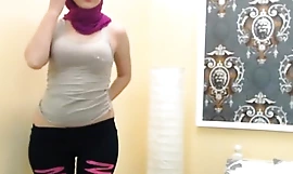 Crestfallen Arab muslim Hijab girl winking on cam - See almost elbow EliteArabCams free porn blear